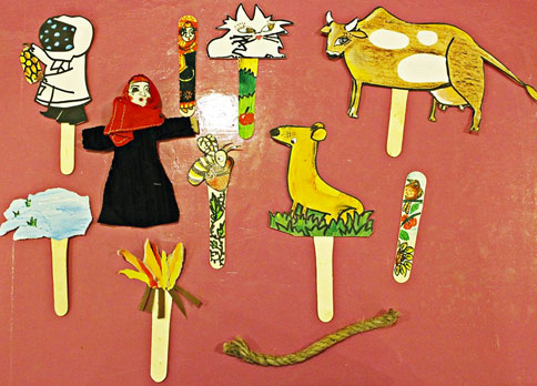 Stick puppets using characters from the book The Farmer's Wife
