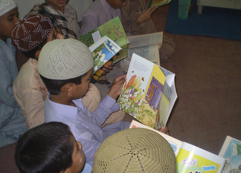 Pakistani kids reading the Old Woman and the Eagle