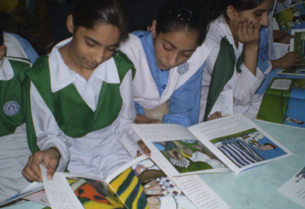 Girls in Pakistan reading Hoopoe Books