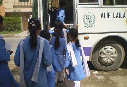 Girls getting on Alif Laila bus