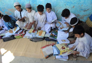 Girls and boys in the one-room schools run by HOPE in FATA