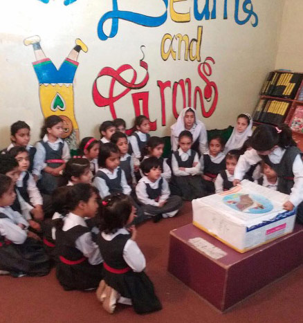Children opening a box library from Alif Laila