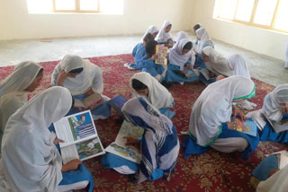 Girls in reading circles enjoying Hoopoe books